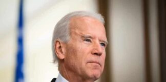Person in a suit with a serious expression.