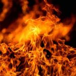 Free Speech Under Fire: Albanian Opposition Fights Back Against Lawmaker’s Imprisonment Bright orange flames against a dark background.