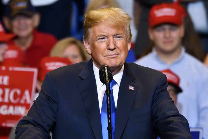1148867840 featured image Man in suit speaking at a rally.