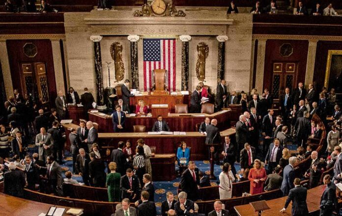 1186368265 featured image Crowded legislative chamber with people in discussion