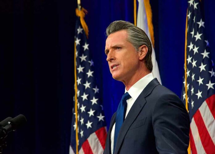 2136570847 featured image Man speaking at a podium with American flags.