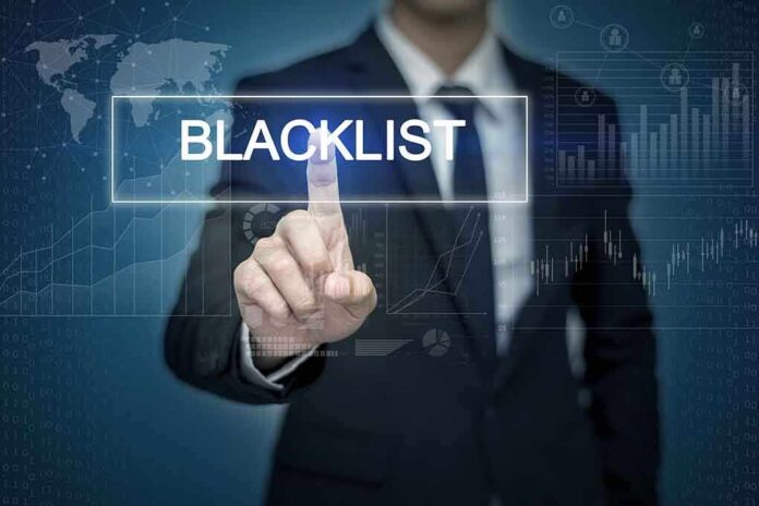 385872217 featured image Man pressing virtual "blacklist" button.