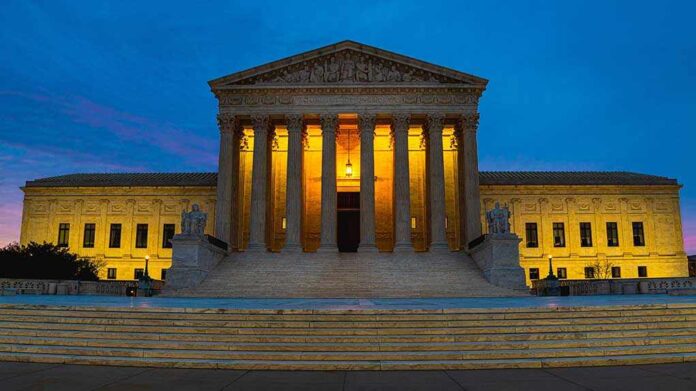 1667066965 featured image Illuminated courthouse building at dusk with columns