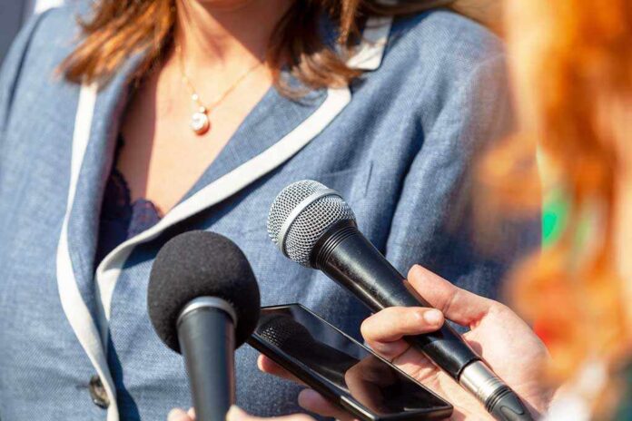 1919087669 featured image Microphones and smartphone held towards a person speaking