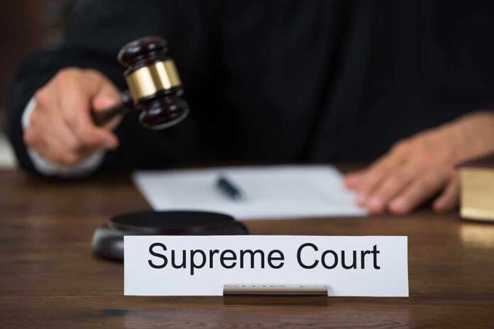 359957222 featured image Judge with gavel and Supreme Court nameplate.