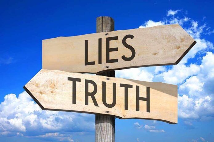 532218352 featured image Signs pointing to "Lies" and "Truth" against sky.