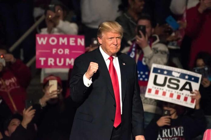 560025514 featured image Man in suit surrounded by supportive crowd holding signs