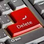 Close-up of a keyboard with red "Delete" key.