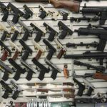 Wall display with handguns and rifles for sale