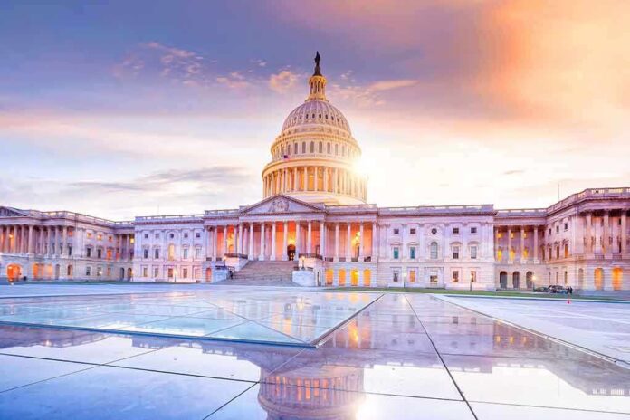 Capitol building at sunrise with a reflective foreground