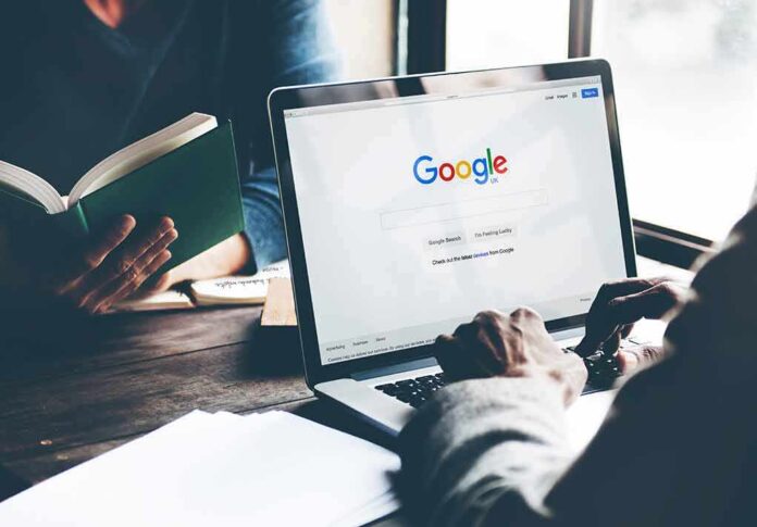 2031053153 featured image Laptop on Google homepage person reading a book