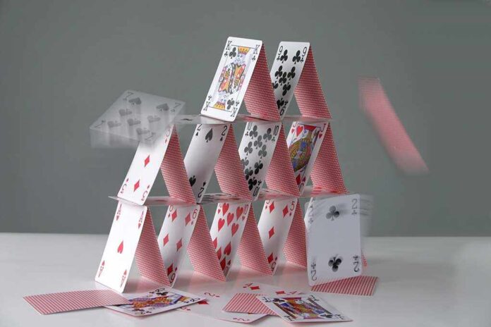 2130029 featured image Collapsing house of cards in motion
