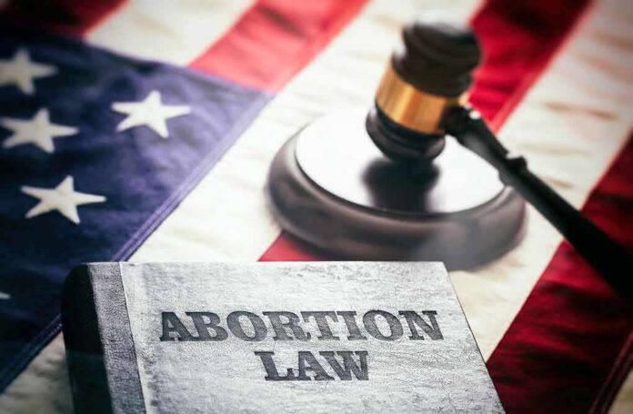 2182069301 featured image Book titled Abortion Law gavel American flag background