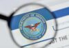 Magnifying glass over Department of Defense logo