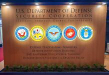 US Department of Defense Security Cooperation display with logos