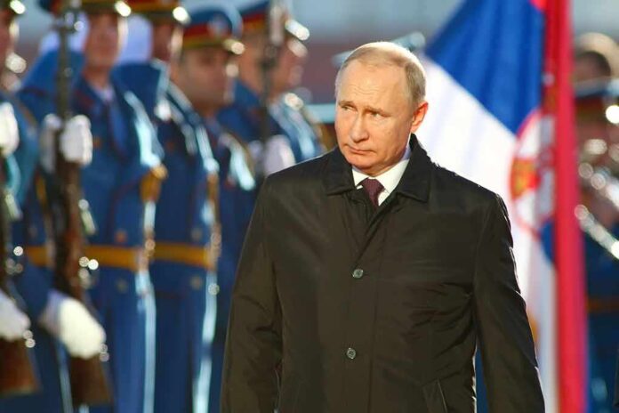 1468367888 featured image Man in black coat with soldiers in background