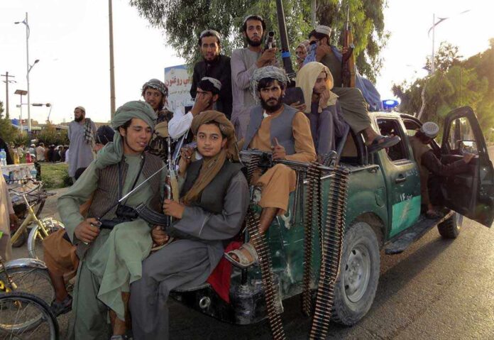 2026737029 featured image Armed men sitting on a pickup truck