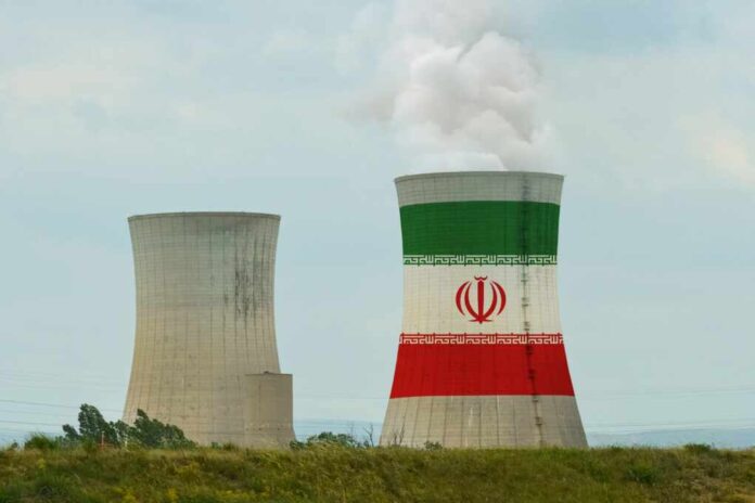 2371145901 featured image Two cooling towers with Iranian flag design outdoors