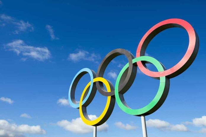 328832081 featured image Olympic rings sculpture against blue sky
