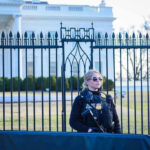 Secret Service agent stands guard outside the White House