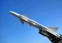 missile against a clear blue sky