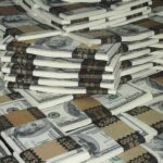 Piles of bundled cash stacked together