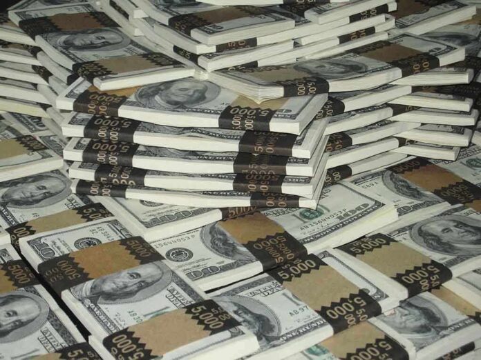 shutterstock_3315452.jpg Piles of bundled cash stacked together