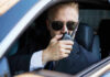 Man in suit using walkie talkie