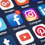 Social media app icons on a smartphone screen