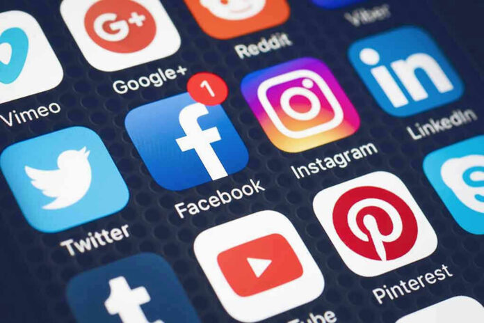 Social media app icons on a smartphone screen