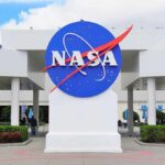 Gigantic Comet Panic—NASA Drops Jaw-Dropping Data NASA logo displayed prominently at a visitor center