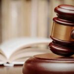 Violent Pro-Life Attacker Avoids Prison A wooden gavel resting on a sound block with law books in the background