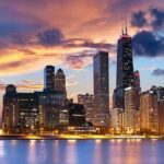 Chicago Mayor DEFIES Crackdown—Chaos Erupts Chicago skyline at sunset with colorful clouds