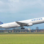 United airplane taking off from a runway.