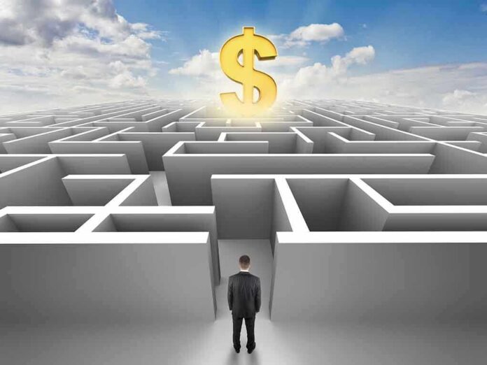 A man in a suit standing at the entrance of a maze with a dollar sign above