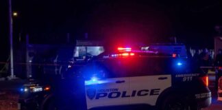 Houston police vehicle with emergency lights activated at night