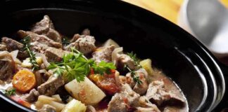 A hearty beef stew with vegetables in a slow cooker