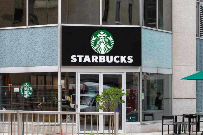 2320394477 Starbucks storefront with glass doors and logo