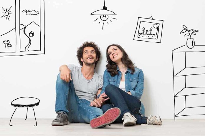shutterstock_206266147.jpg A couple sitting on the floor against a wall with playful illustrations