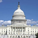 ICE Deputy QUITS — Launches SHOCKING Political Campaign U.S. Capitol building against blue sky.