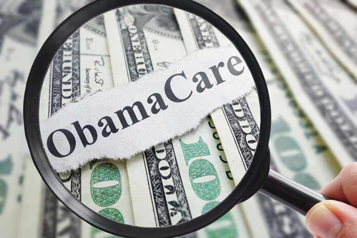 Magnifying glass over Obamacare text and money