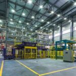 Interior view of a modern industrial facility with manufacturing equipment