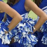 Bond Shock: Cheerleader’s Murder Suspect Goes Free Cheerleaders in blue and white uniforms holding pom poms