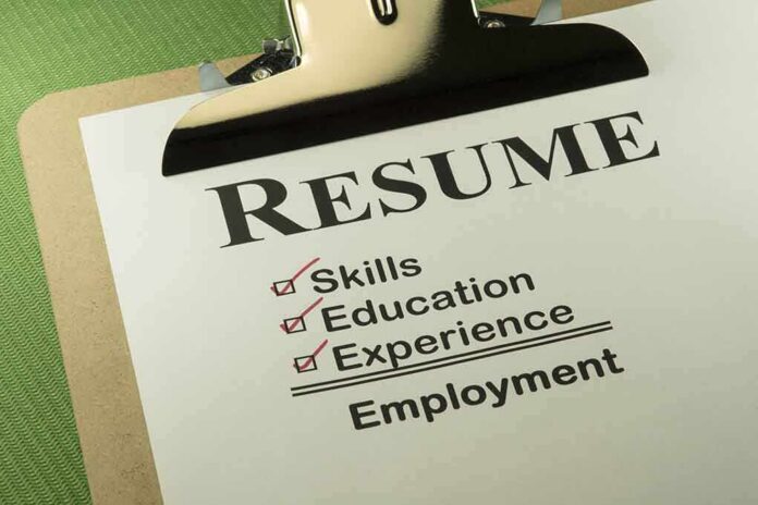 A resume checklist on a clipboard highlighting skills, education, experience, and employment
