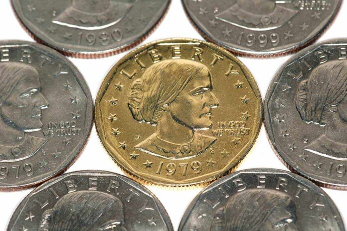 A collection of coins featuring a gold coin surrounded by silver coins