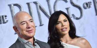 Two people posing at an event.