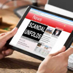 Person reading news headline Scandal Unfolds on tablet