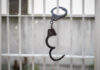 Cuba Releases Prisoners; Russia Gains Influence Handcuffs hanging on a barred window.