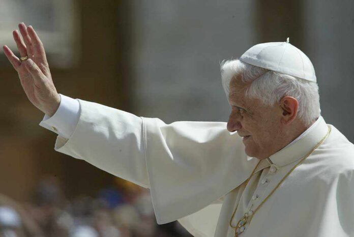 Pope waving to a crowd during a public appearance