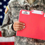Airman Turned Traitor? $200K Reward for Runaway Spy U.S. Army soldier holds a Top Secret folder.